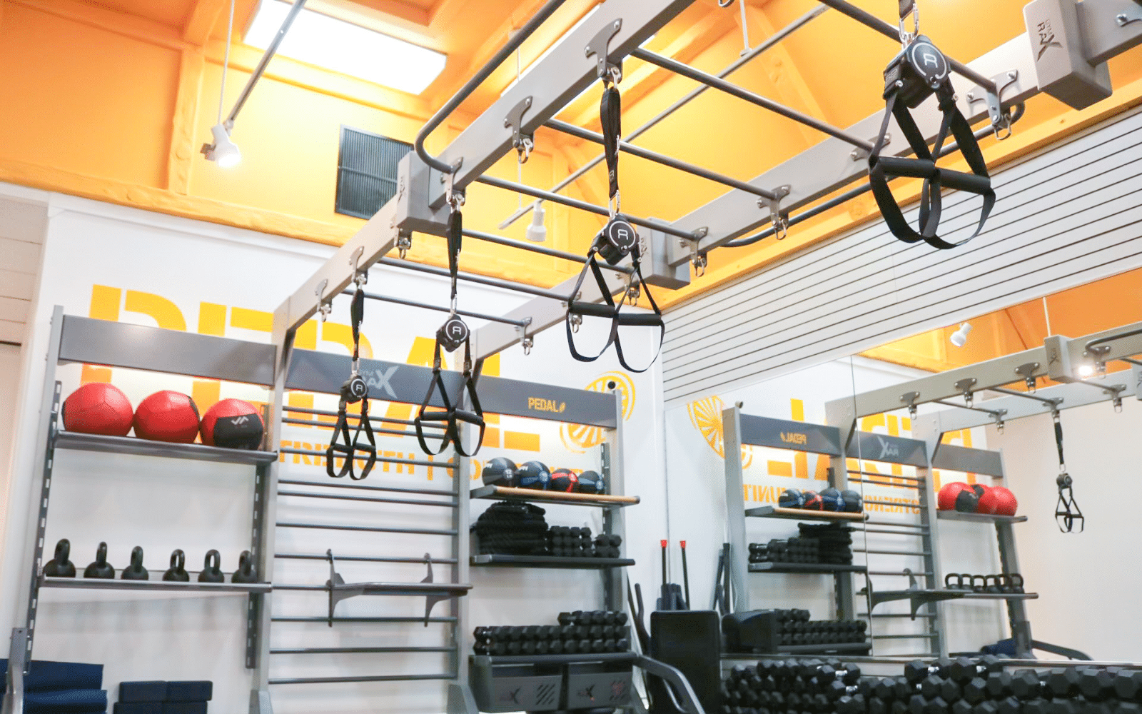recoil suspension trainer on gym rax bridge and storage